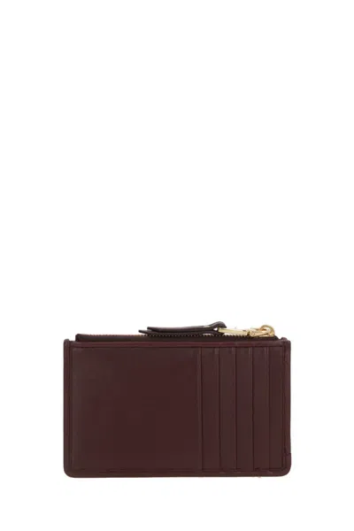 Miu Miu Quilted Zip Wallet In Brown