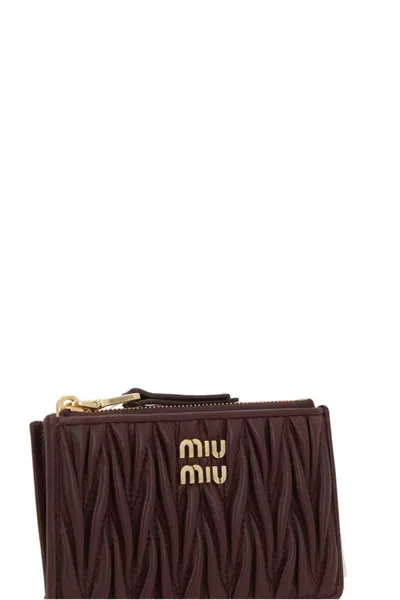 Miu Miu Quilted Zip Wallet In Brown