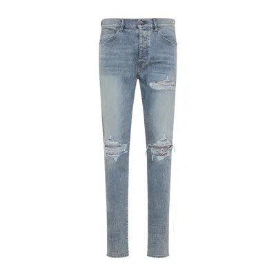 Amiri Distressed Five-pocket Denim Trousers In Blue