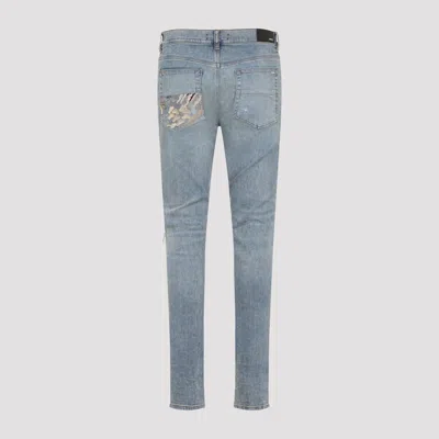 Amiri Distressed Five-pocket Denim Trousers In Blue
