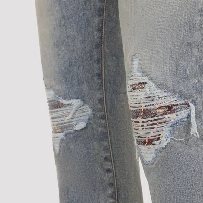 Amiri Distressed Five-pocket Denim Trousers In Blue