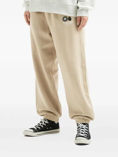 Fingercroxx Logo-patch Cuffed Track Pants In Multi