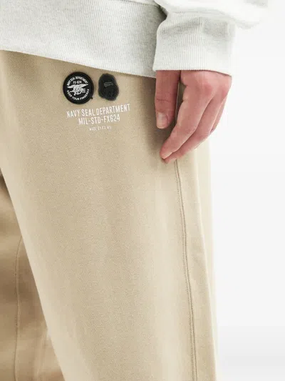 Fingercroxx Logo-patch Cuffed Track Pants In Multi