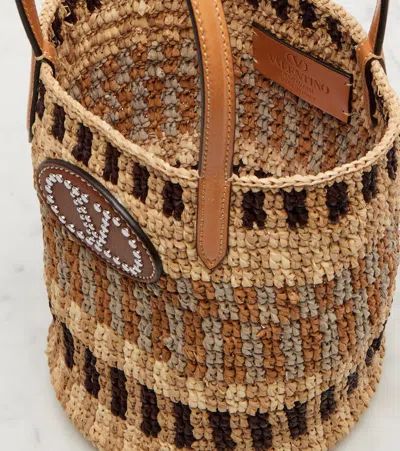 Valentino Garavani Small Vlogo Signature Crocheted Raffia Bucket Bag In Brown