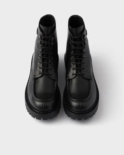 Prada Laced Leather Booties In Black