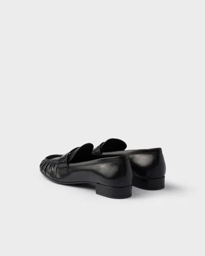 Prada Rounded Toe Loafers With Textured Detailing And Low Block Heel In Black