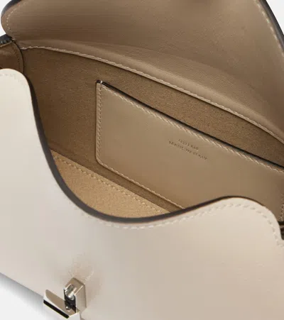 Totême T-lock Grained-leather Clutch Milk In White
