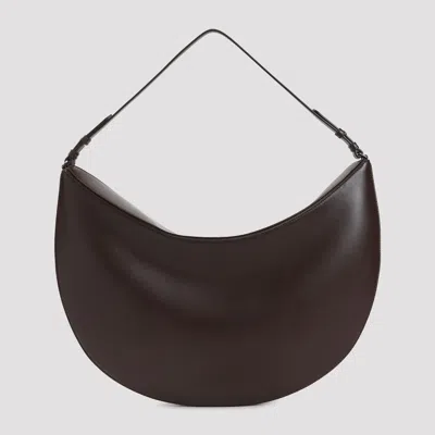 Jacquemus Le Calisso Rond Large Brown Shoulder Bag With Adjustable Strap And Embossed Logo In Leathe In Brown