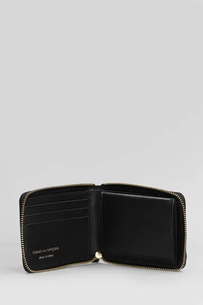 Comme Des Garçons Embossed Logotype Wallet In Black