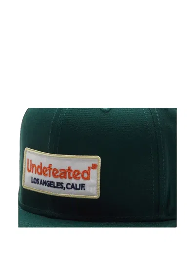 Undefeated Patch Snapback Cap In Green