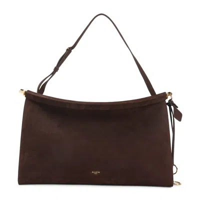 Alaïa Le Click East West Large Bag In Nubuck In Brown