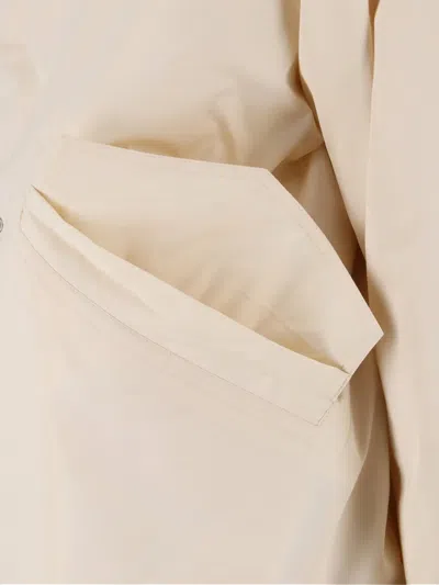 Jil Sander Hooded Longline Jacket With Faux Fur Trim In Neutral