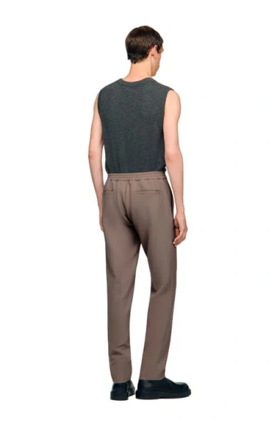 Sandro Jersey Trousers In Brown