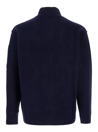 C.p. Company Blue Jacket With High Neck And Logo Plaque On The Sleeve In Wool Blend Man In Blue