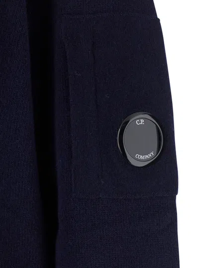 C.p. Company Blue Jacket With High Neck And Logo Plaque On The Sleeve In Wool Blend Man In Blue