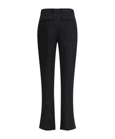Alexander Mcqueen Tailored Wool Trousers Featuring Flared Hem In Black