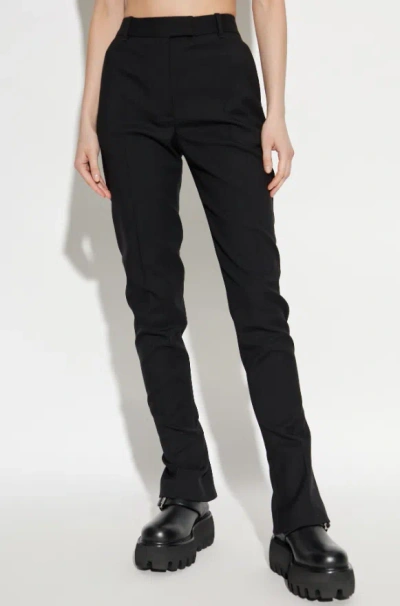 Alexander Mcqueen Tailored Wool Trousers Featuring Flared Hem In Black