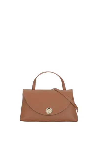 Coccinelle Curved Top Handbag With Circular Detail And Detachable Shoulder Strap In Black