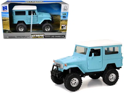 New Ray Toyota Land Cruiser Fj40 Light Blue With White Top "xtreme Off-road" Series 1/24 Diecast Model By Ne In Blue