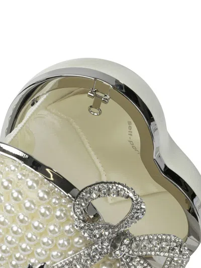 Self-portrait Heart-shaped Clutch In Sand