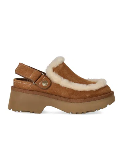 Ugg Suede Mules With Plush Trim And Adjustable Strap In Brown