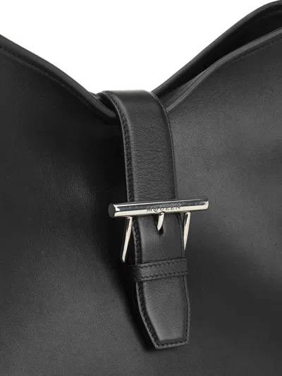 Alexander Mcqueen Black Shoulder Bag With Adjustable Shoulder Strap And T Buckle Closure On The Front In Leather Woman In Black