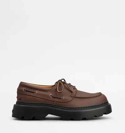 Tod's Boat Shoes With Chunky Sole And Eyelet Detailing In Brown