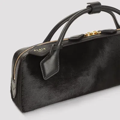 Alaïa Le Teckel Leather-trimmed Calf Hair Clutch In Brown