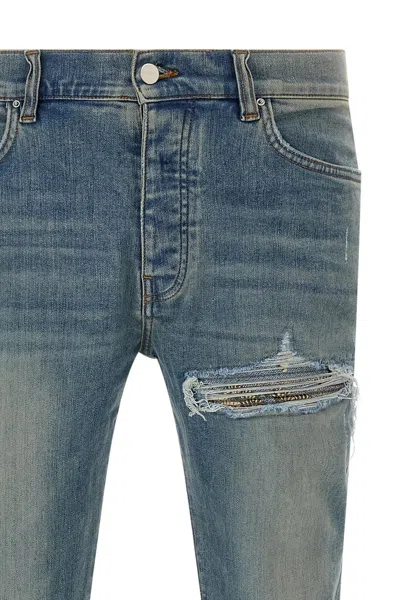 Amiri Distressed Five-pocket Denim Trousers In Blue