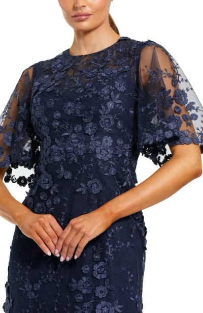 Mac Duggal Flutter Sleeve Floral Emboridered Net Gown In Blue