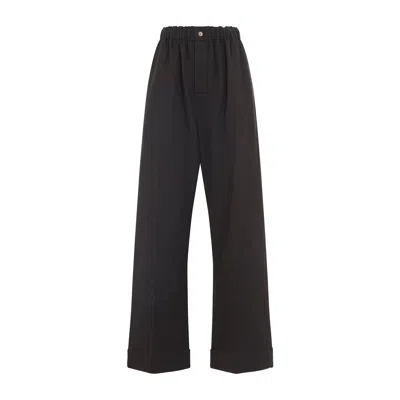 Carven Wide-leg Wool Trousers With Elastic Waistband And Buttoned Details In Black