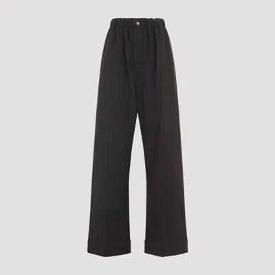 Carven Wide-leg Wool Trousers With Elastic Waistband And Buttoned Details In Black