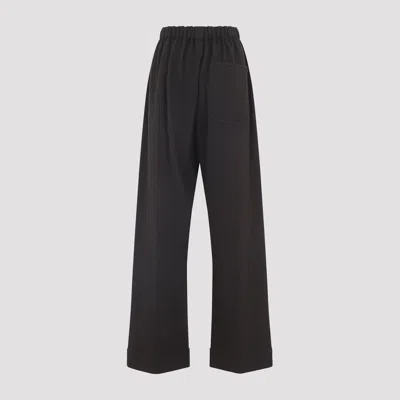 Carven Wide-leg Wool Trousers With Elastic Waistband And Buttoned Details In Black