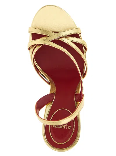 Valentino Garavani Fetishique Sandal In Laminated Nappa 105mm Woman Antique Brass 40 In Gold