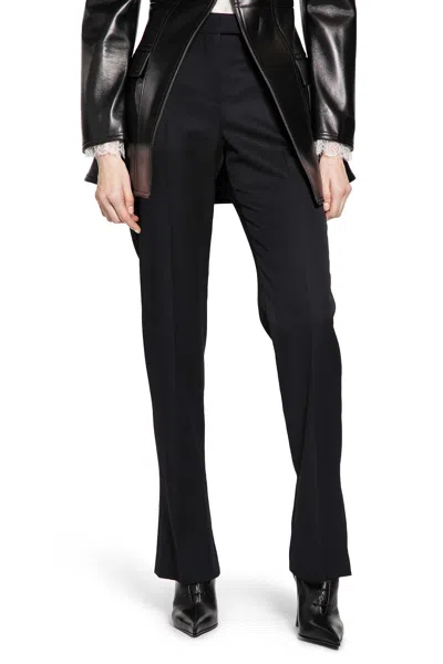 Alexander Mcqueen Tailored Wool Trousers Featuring Flared Hem In Black