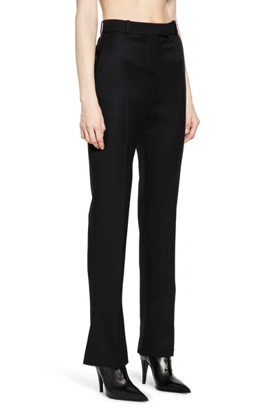 Alexander Mcqueen Tailored Wool Trousers Featuring Flared Hem In Black
