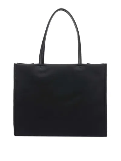 Tory Burch Spacious Black Tote With Embossed Logo And Sturdy Handles In Black