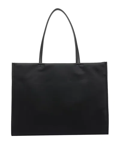 Tory Burch Spacious Black Tote With Embossed Logo And Sturdy Handles In Black