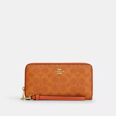 Coach Long Zip Around Wallet In Signature Canvas In Orange