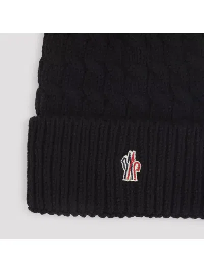 Moncler Wool Hat Featuring Cable Knit And Pom Detail In Black