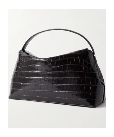 Totême Leather Handbag Featuring Adjustable Strap In Black