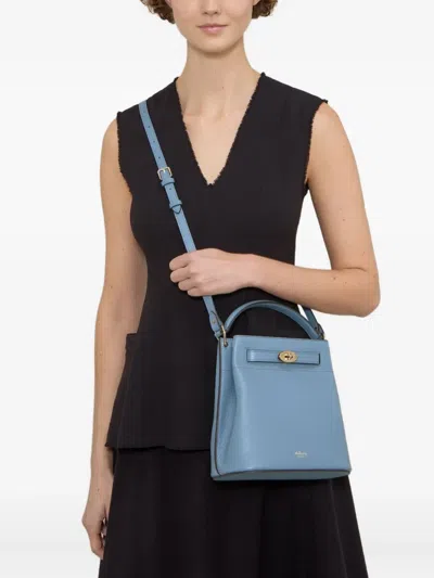 旋扣斜挎水桶包