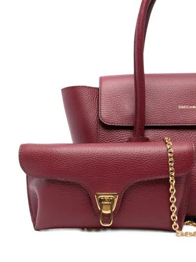 Coccinelle Double Beat Medium Leather Bag In Burgundy