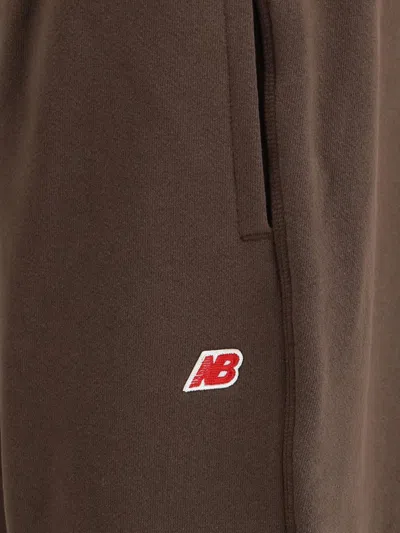New Balance Cotton Trousers Featuring Elastic Waistband In Brown
