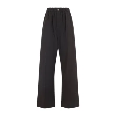 Carven Wide-leg Wool Trousers With Elastic Waistband And Buttoned Details In Black
