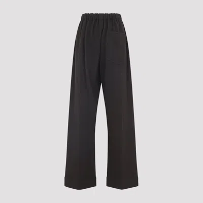 Carven Wide-leg Wool Trousers With Elastic Waistband And Buttoned Details In Black
