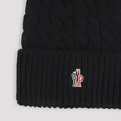 Moncler Wool Hat Featuring Cable Knit And Pom Detail In Black