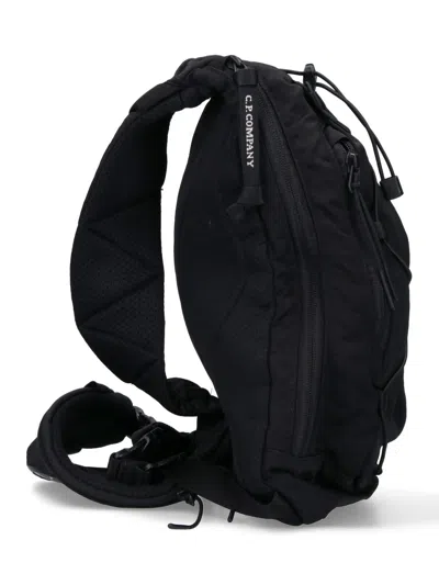 C.p. Company One-shoulder Logo Backpack In Black