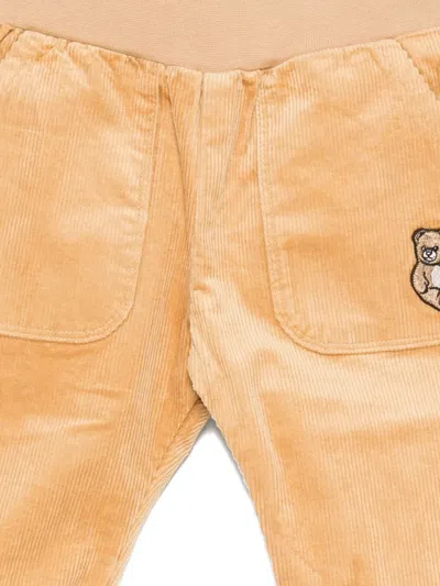Moschino Teddy-embroidered Corduroy Pants In Orange