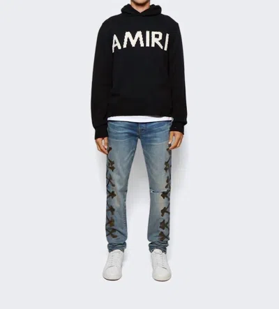 Amiri Camouflage Bones Jean In Stonewashed In Blue